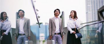 Japanese professionals demonstrating excellent teamwork, a key skill in Japan's group-oriented work culture.